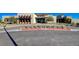 Modern building exterior with desert landscaping and ample parking at 924 Allister Fields Ln, Las Vegas, NV 89138