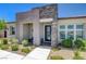 Beautiful home featuring a stone-accented entrance, modern design, and well-maintained landscaping at 924 Allister Fields Ln, Las Vegas, NV 89138