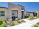 Attractive home exterior showcasing a welcoming entrance and low-maintenance desert landscaping at 924 Allister Fields Ln, Las Vegas, NV 89138