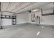 Spacious garage with a sealed floor, overhead storage, and built-in shelving at 924 Allister Fields Ln, Las Vegas, NV 89138