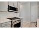 Modern kitchen with stainless steel appliances and stylish gas range at 924 Allister Fields Ln, Las Vegas, NV 89138