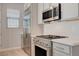 Updated kitchen featuring stainless steel appliances, modern cabinetry, and quartz countertops at 924 Allister Fields Ln, Las Vegas, NV 89138