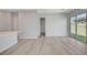 Spacious living room with modern flooring and a sliding glass door to the backyard at 924 Allister Fields Ln, Las Vegas, NV 89138