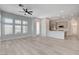 Open living room with lots of natural light and a view of the modern kitchen at 924 Allister Fields Ln, Las Vegas, NV 89138