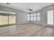 Open-concept living room with lots of natural light, and sliding glass door to back yard at 924 Allister Fields Ln, Las Vegas, NV 89138