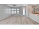 A wide-open living space, with wood floors, adjacent to an eat-in kitchen area at 924 Allister Fields Ln, Las Vegas, NV 89138