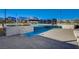 This inviting community pool includes a separate splash area for children, surrounded by comfortable seating at 924 Allister Fields Ln, Las Vegas, NV 89138