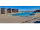 Beautiful community pool with modern lounge chairs, shaded areas, and city views for a luxurious experience at 924 Allister Fields Ln, Las Vegas, NV 89138