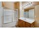 Cozy bathroom featuring a shower-tub combo with sliding doors, vanity and bright lighting at 9303 Gilcrease Ave # 2198, Las Vegas, NV 89149
