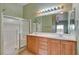 Bathroom featuring a double sink vanity, shower, and well-lit mirror for daily routines at 9303 Gilcrease Ave # 2198, Las Vegas, NV 89149