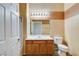Neutral bathroom featuring a single sink vanity, large mirror and bright lighting at 9303 Gilcrease Ave # 2198, Las Vegas, NV 89149