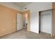 Bedroom with closet, neutral carpet, and access to hallway, providing ample storage at 9303 Gilcrease Ave # 2198, Las Vegas, NV 89149