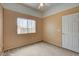 Bright bedroom with carpet, two-tone paint, and a window at 9303 Gilcrease Ave # 2198, Las Vegas, NV 89149