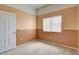 Bright bedroom with neutral carpet, a window and a closet at 9303 Gilcrease Ave # 2198, Las Vegas, NV 89149