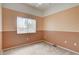 Neutral bedroom with a window providing natural light and spacious closet at 9303 Gilcrease Ave # 2198, Las Vegas, NV 89149