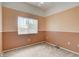 A serene bedroom featuring a window and neutral carpet at 9303 Gilcrease Ave # 2198, Las Vegas, NV 89149