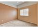 Bright bedroom featuring neutral carpet and a large window at 9303 Gilcrease Ave # 2198, Las Vegas, NV 89149