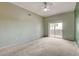 Bright bedroom featuring balcony access and neutral walls at 9303 Gilcrease Ave # 2198, Las Vegas, NV 89149