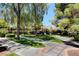 Community grounds featuring walking paths, mature trees and green spaces at 9303 Gilcrease Ave # 2198, Las Vegas, NV 89149