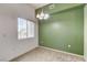 A bright dining room with a window and view and contemporary chandelier at 9303 Gilcrease Ave # 2198, Las Vegas, NV 89149