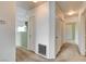 Hallway featuring neutral carpet and multiple doors, offering convenience to other rooms at 9303 Gilcrease Ave # 2198, Las Vegas, NV 89149
