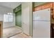 Open kitchen featuring light colored cabinets, white appliances, and an adjacent eating area at 9303 Gilcrease Ave # 2198, Las Vegas, NV 89149