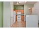A kitchen and eat-in area featuring tile floors and white appliances at 9303 Gilcrease Ave # 2198, Las Vegas, NV 89149