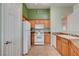 Bright kitchen featuring modern appliances, wooden cabinetry, and ample counter space at 9303 Gilcrease Ave # 2198, Las Vegas, NV 89149