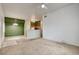 Carpeted living room with a half wall separating it from the kitchen and tile at the entrance at 9303 Gilcrease Ave # 2198, Las Vegas, NV 89149