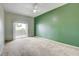 Airy bedroom featuring plush carpeting, ceiling fan, and sliding glass doors to the balcony at 9303 Gilcrease Ave # 2198, Las Vegas, NV 89149