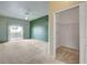 Spacious main bedroom featuring plush carpet, ceiling fan, and sliding doors to balcony at 9303 Gilcrease Ave # 2198, Las Vegas, NV 89149