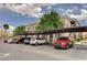 A view of the covered parking area and residential condo building in the background at 9303 Gilcrease Ave # 2198, Las Vegas, NV 89149