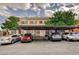 A view of the covered parking with assigned parking space numbers and multiple parked cars at 9303 Gilcrease Ave # 2198, Las Vegas, NV 89149