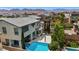 Aerial shot of property with a large backyard pool, spa, basketball court and mountain views at 9710 Hiking Ave, Las Vegas, NV 89166