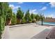 Backyard with basketball court, swimming pool and landscaping at 9710 Hiking Ave, Las Vegas, NV 89166