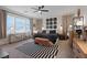 Comfortable bedroom with stylish decor, featuring a ceiling fan and plenty of natural light at 9710 Hiking Ave, Las Vegas, NV 89166