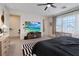 Spacious bedroom with modern ceiling fan and lots of natural light at 9710 Hiking Ave, Las Vegas, NV 89166