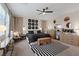 Comfortable bedroom with stylish decor, featuring a ceiling fan and plenty of natural light at 9710 Hiking Ave, Las Vegas, NV 89166