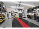 Spacious garage featuring epoxy flooring, storage solutions, and bright lighting at 9710 Hiking Ave, Las Vegas, NV 89166