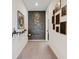 Hallway features stylish accent wall and unique decorations, creating a modern aesthetic at 9710 Hiking Ave, Las Vegas, NV 89166