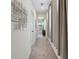 Hallway features full-length curtains and neutral tones, creating a modern aesthetic at 9710 Hiking Ave, Las Vegas, NV 89166