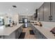 Well-appointed kitchen featuring gray cabinets, stainless steel appliances, and a spacious quartz countertop at 9710 Hiking Ave, Las Vegas, NV 89166