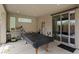 Covered outdoor patio with built-in barbecue grill, stainless steel fixtures, and sliding glass door access to indoors at 9710 Hiking Ave, Las Vegas, NV 89166