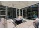 Inviting patio with plush seating around a fire pit and seamless indoor/outdoor flow at 9710 Hiking Ave, Las Vegas, NV 89166