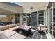 Comfortable patio with cozy seating around a modern fire pit and views of the yard at 9710 Hiking Ave, Las Vegas, NV 89166
