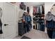 Functional walk-in closet with ample storage space and well-organized shelves and racks at 9710 Hiking Ave, Las Vegas, NV 89166