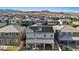 Real estate image showcasing an aerial view of a home with solar panels, a backyard and landscaping in a desert community at 10057 Matter Overlook Dr, Las Vegas, NV 89178