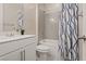 Bright bathroom with a shower-tub combination, neutral tiling, and a sleek vanity with ample counter space at 10057 Matter Overlook Dr, Las Vegas, NV 89178