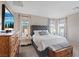 Comfortable bedroom boasts ample natural light, stylish decor, and a relaxing ambiance at 10057 Matter Overlook Dr, Las Vegas, NV 89178