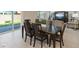 Cozy dining space with outdoor access and a view of the living room, ideal for Gathering meals and entertaining at 10057 Matter Overlook Dr, Las Vegas, NV 89178